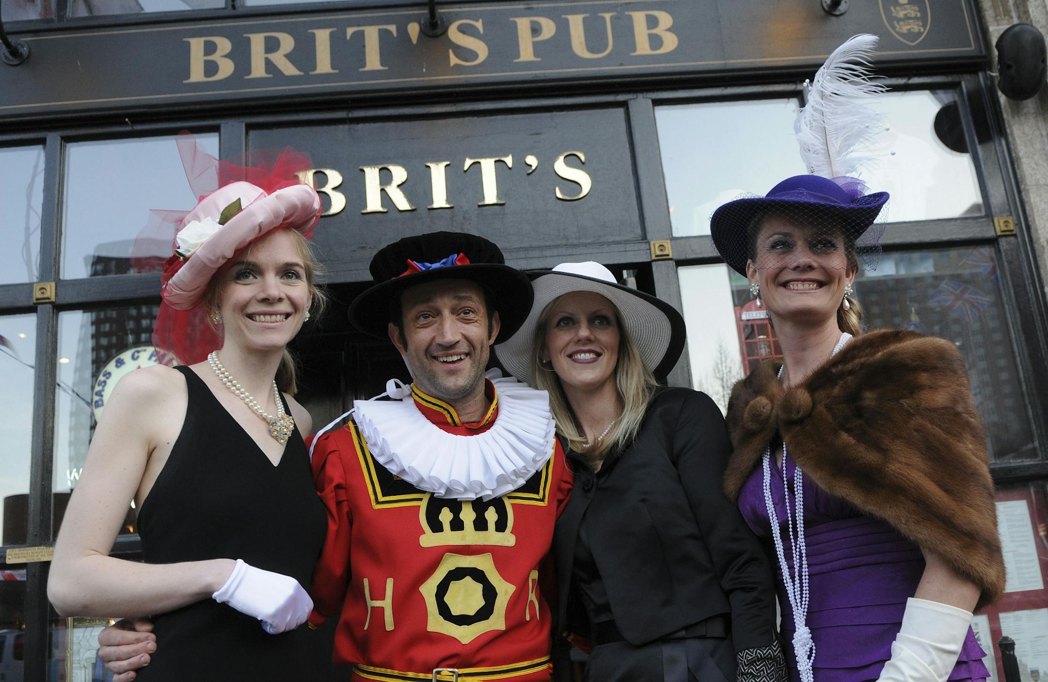 Brit's Pub served a traditional English breakfast buffet and wedding cake for patrons who came to celebrate the Royal wedding of Prince William and Kate Middleton, the doors opened at 4:00 AM for live big screen coverage of the royal wedding.Heidi Caccamo of Ardens Hills, Brage Hanson of Chaska and Laura Fixsen of Shoreview posed with Vincent Francoual dressed as a Beefeater in front of Brit's Pub.
