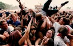 July 12, 1994 Lollapalooza 94, the fourth annual alternative rock festival held at Harriet Island in St. Paul. Fans are passed around in the Mosh Pit 