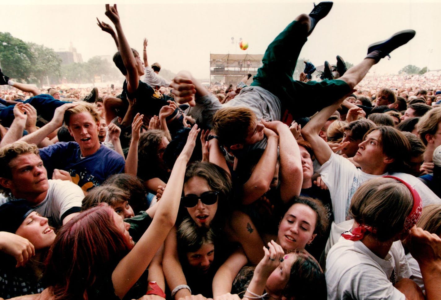 July 12, 1994 Lollapalooza 94, the fourth annual alternative rock festival held at Harriet Island in St. Paul. Fans are passed around in the Mosh Pit next to the stage during the set by the band, "L7". July 13, 1994 Joey McLeister, Minneapolis Star Tribune