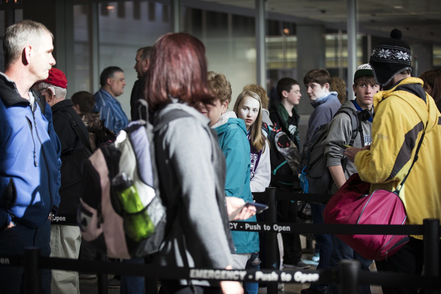 Passengers wait in line to go through the new north security checkpoint at Terminal 1 of Minneapolis-St. Paul International Airport. ] (Leila Navidi/Star Tribune) leila.navidi@startribune.com BACKGROUND INFORMATION: Friday, February 26, 2016 at Terminal 1 of Minneapolis-St. Paul International Airport.