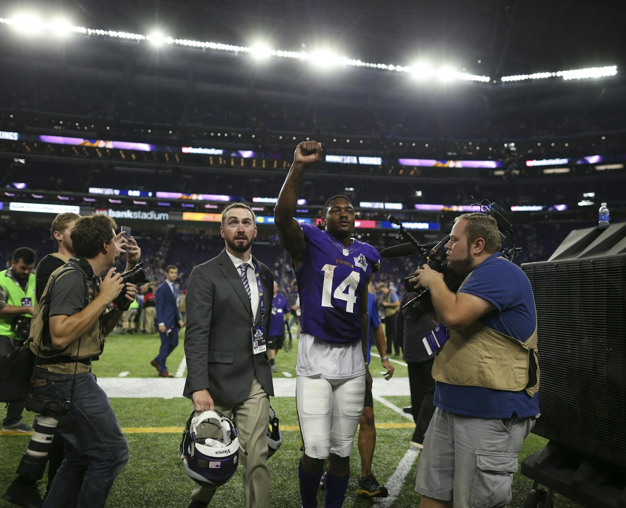 Vikings wide receiver Stefon Diggs (14) looked up to the stands as he walked off the field after the win over Green Bay.