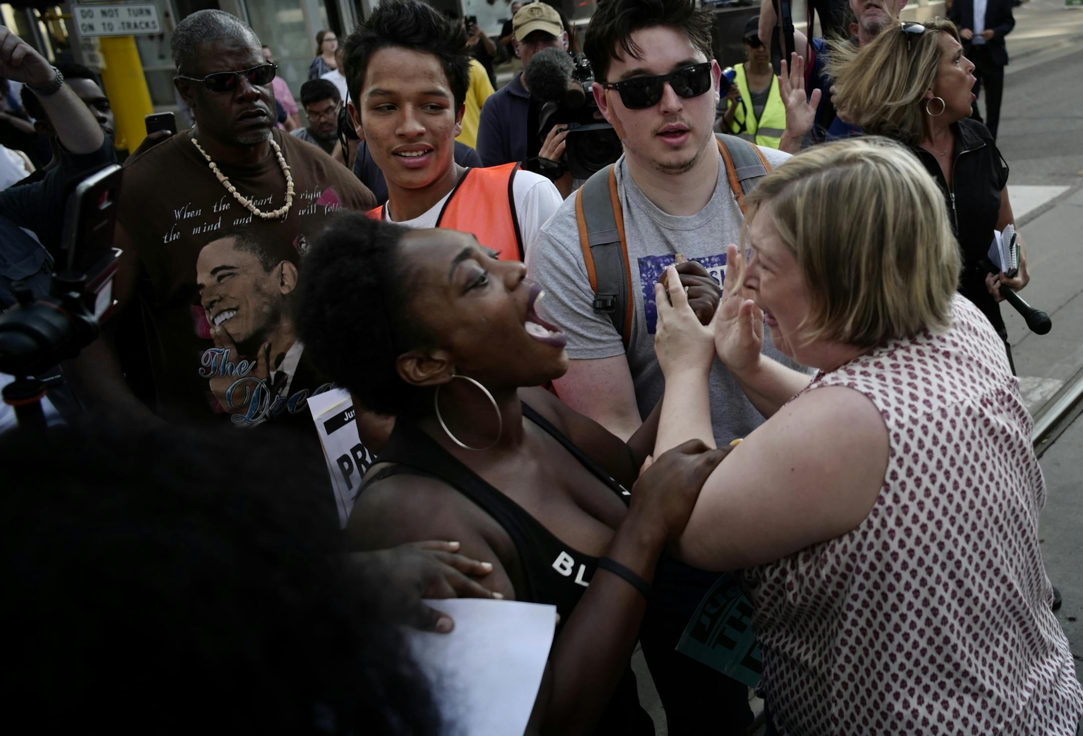 Tensions escalated after a woman suffered a panic attack after her Green Line train was blocked from leaving."I just want to go home," she said.