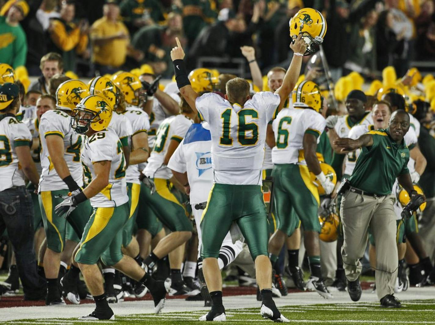 University of Minnesota vs. North Dakota State football. North Dakota State players including quarterback Brock Jensen (16) celebrated an interception that resulted in a touchdown on the closing play of the first half.