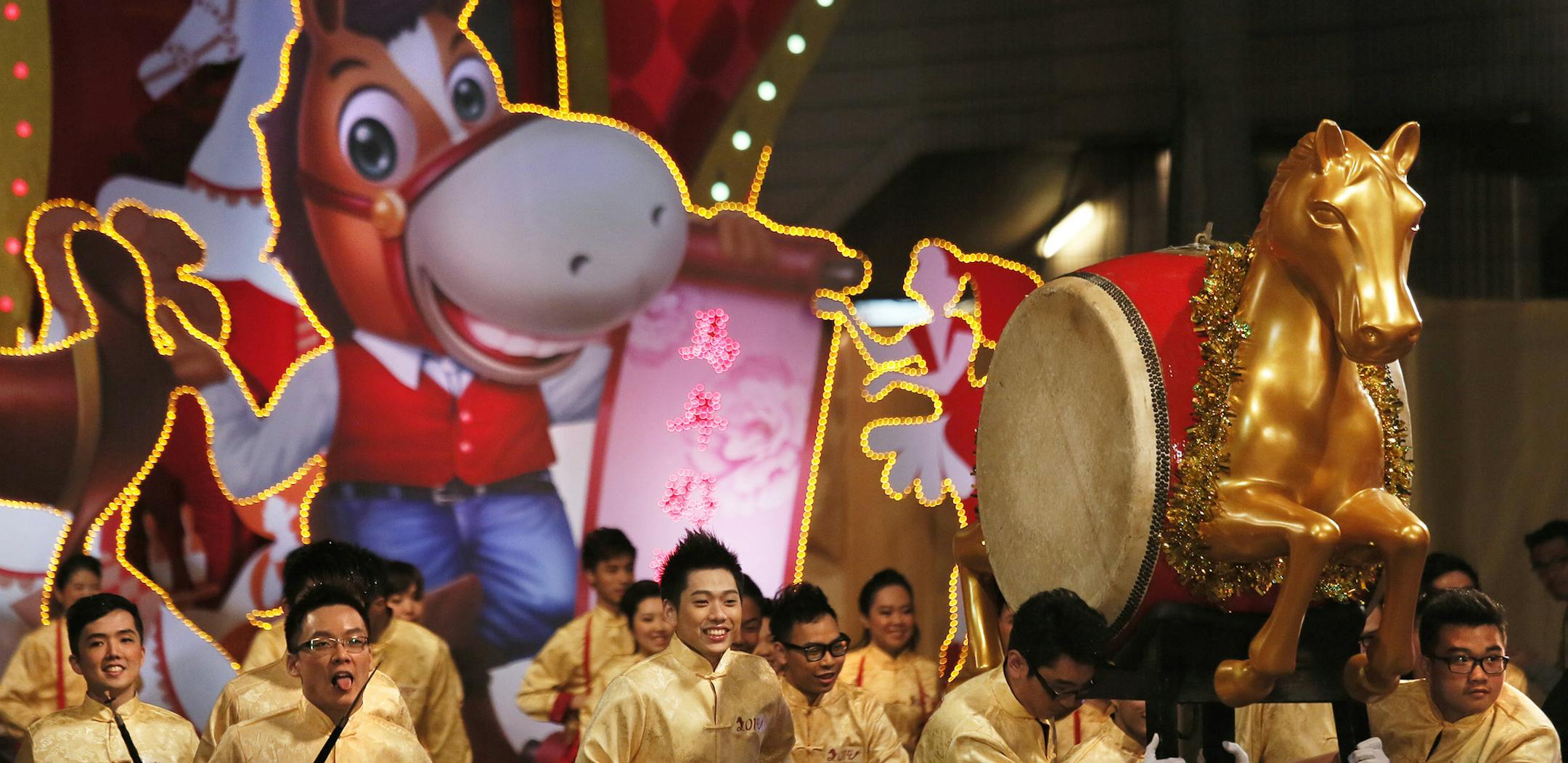 Performers take part in a night parade to celebrate Chinese New Year in Hong Kong, Friday, Jan. 31, 2014. The Lunar New Year this year marks the Year of the Horse in the Chinese calendar. (AP Photo/Vincent Yu)