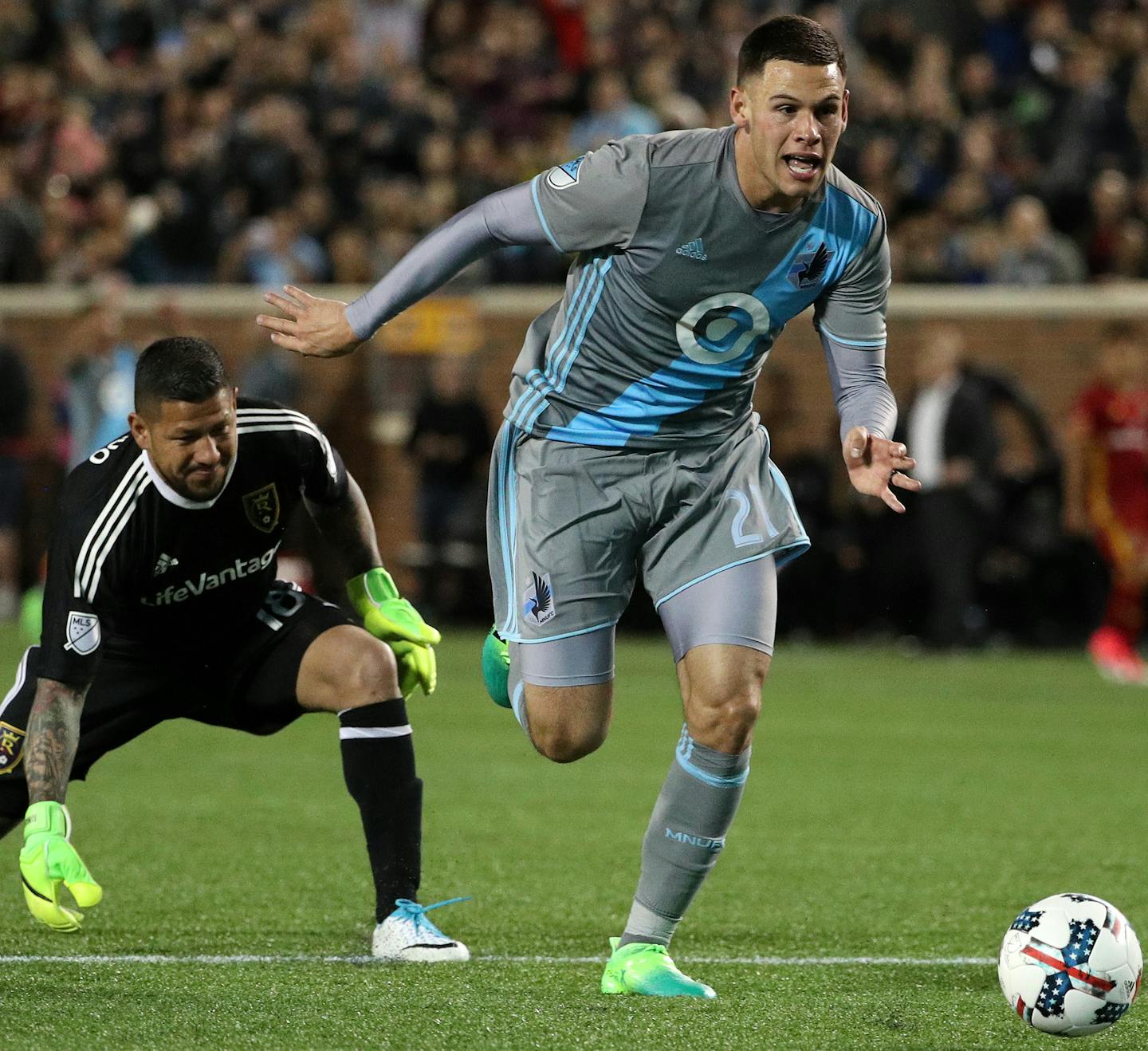 Minnesota United forward Christian Ramirez (21) took the ball from Real Salt Lake goalkeeper Nick Rimando (18) to score in the second half. ] ANTHONY SOUFFLE &#xef; anthony.souffle@startribune.com Game action from an MLS game between the Minnesota United and the Real Salt Lake Saturday, April 1, 2017 at TCF Bank Stadium on the grounds of the University of Minnesota in Minneapolis.