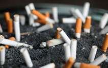 FILE - This March 28, 2019 photo shows cigarette butts in an ashtray in New York. On Tuesday, March 9, 2021. Lung cancer is the nation's top cancer ki
