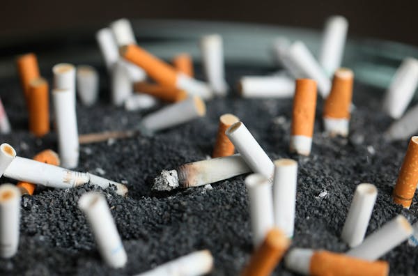 FILE - This March 28, 2019 photo shows cigarette butts in an ashtray in New York. On Tuesday, March 9, 2021. Lung cancer is the nation's top cancer ki