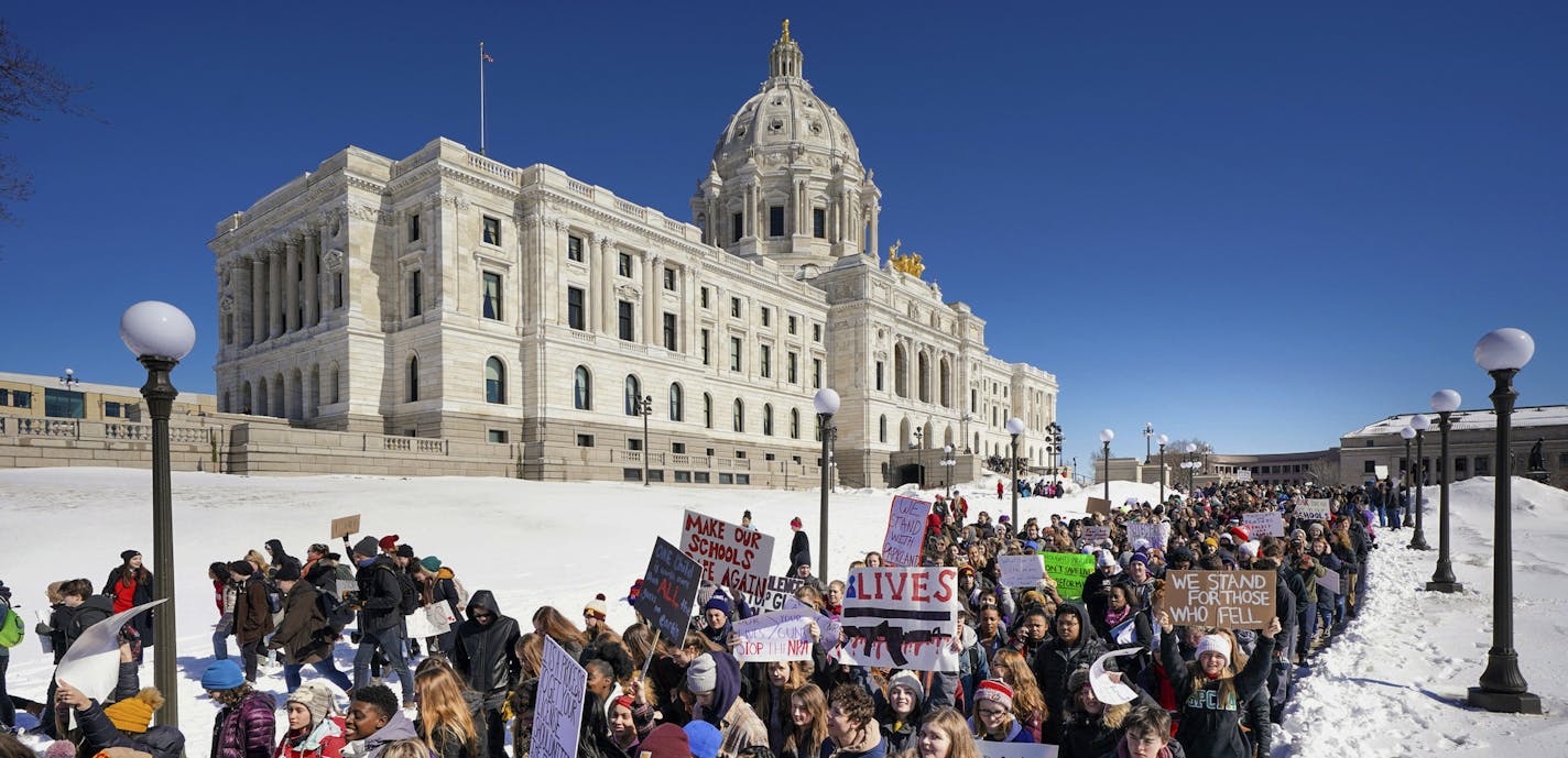 Thousands of high school students march to the state Capitol in Saint Paul, Minn., after they walked out of their schools Wednesday, March 7, 2018, to protest gun violence and pressure lawmakers to enact stricter gun control. (Glen Stubbe/Star Tribune via AP)