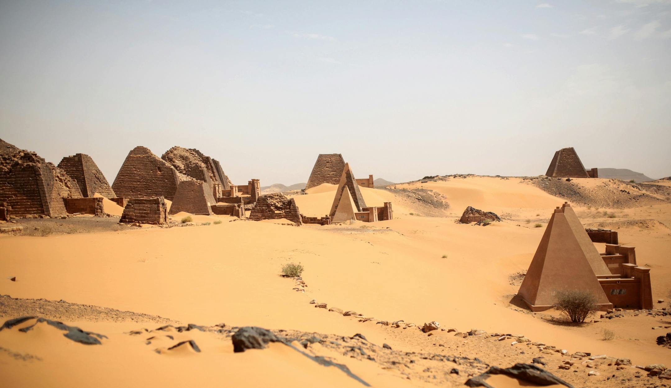 This Thursday, April 16, 2015 photo, shows a general view of the historic Meroe pyramids site, in al-Bagrawiya, 200 kilometers (125 miles) north of Khartoum, Sudan. The steep, small pyramids rise over the desert hills, a stunning reminder of the ancient Nubian kingdom that once ruled Egypt _ and ones not nearly as often visited those of its neighbor. (AP Photo/Mosa'ab Elshamy)