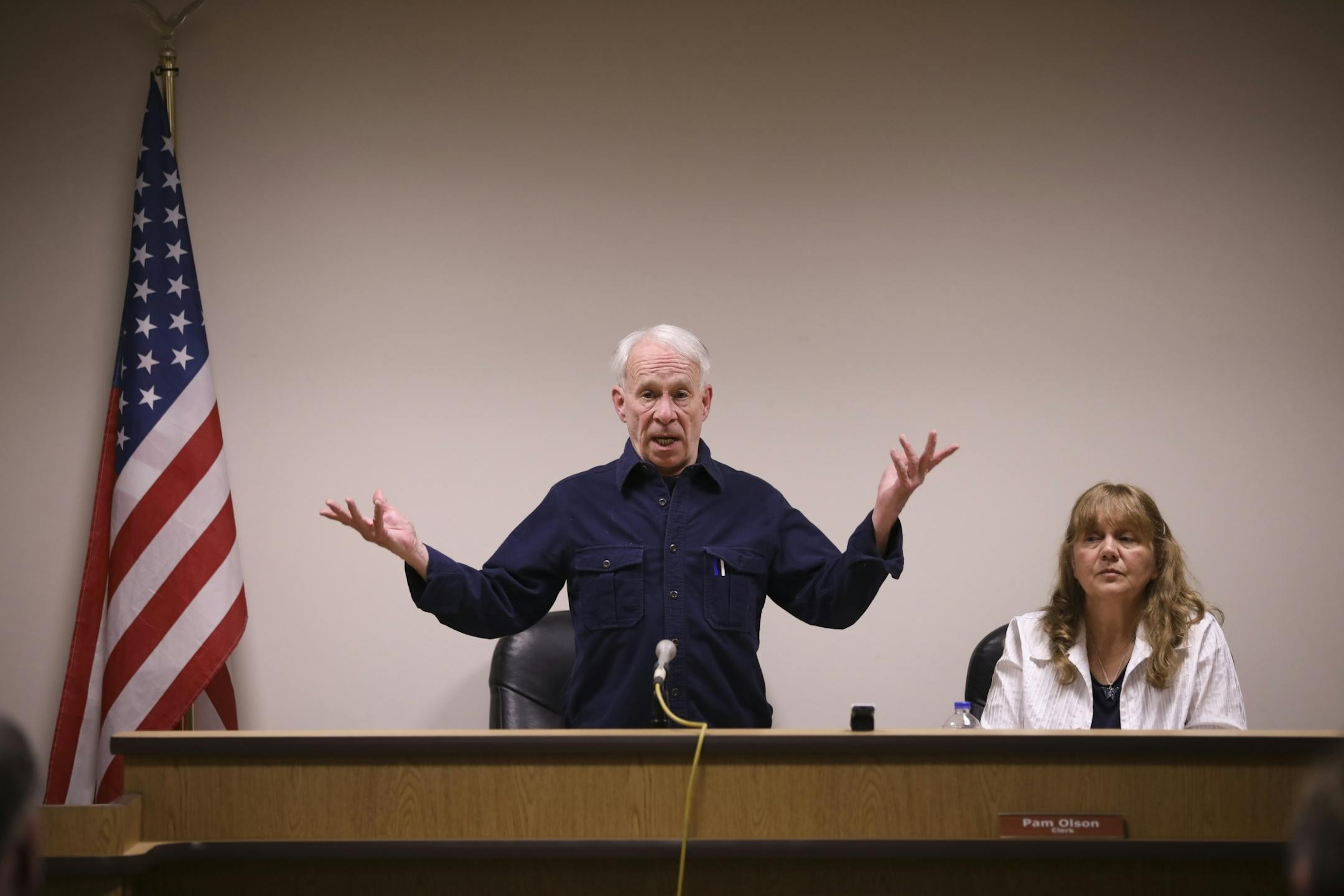 Tom Searing was drafted as Moderator for the Linwood Township annual meeting. He explained that the decision on the tax levy would be the next item for the residents to vote on. Town Clerk Pam Olson was seated next to him.