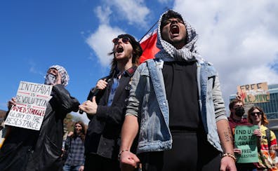 Pro-Palestinian supporters chant during a rally against the latest war between Israel and Hamas after University of Minnesota police cleared an encamp