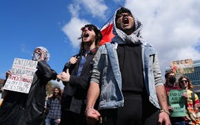 Pro-Palestinian supporters chant during a rally against the latest war between Israel and Hamas after University of Minnesota police cleared an encamp