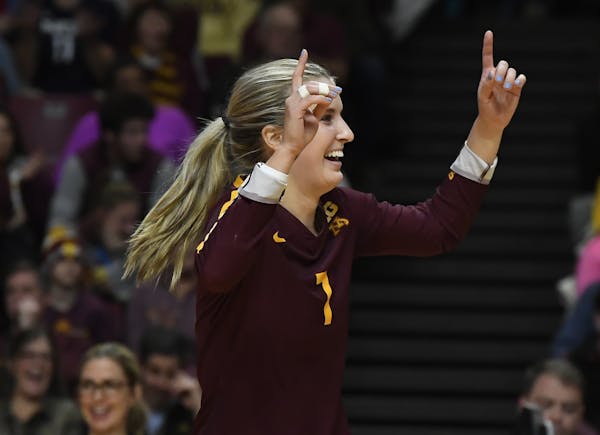 Gophers libero CC McGraw (7) celebrated a point against South Carolina in the second set.