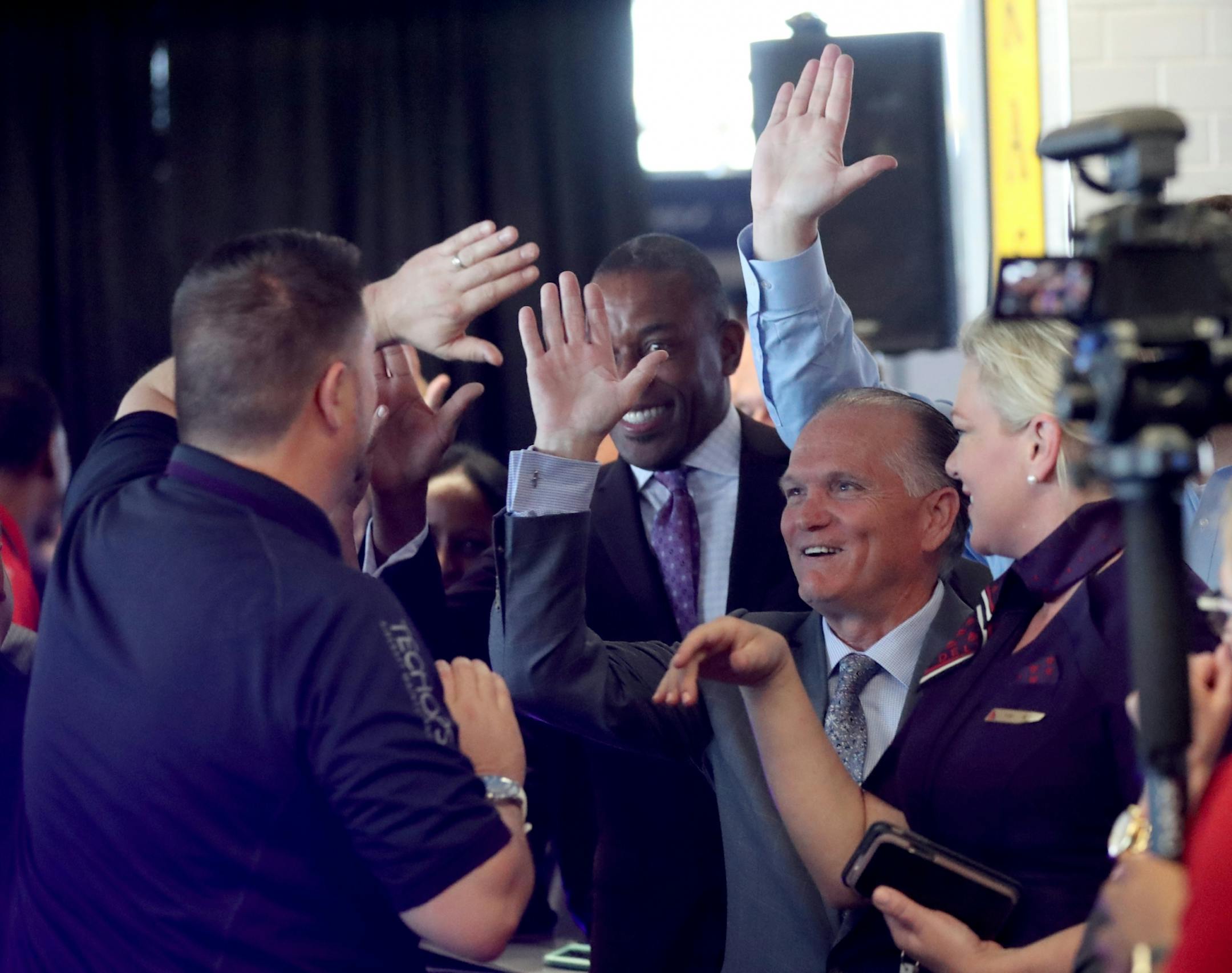 Delta Air Lines launched its new line of uniforms for all its employees during a fashion show at MSP with designer Zac Posen & manufacturer Lands End showcasing the new look Tuesday, May, 29, 2018, at Terminal 1 between Gates G1-G3 at the Minneapolis-St. Paul International Airport in Bloomington, MN. Here, Delta employees in the fashion show took one last walk down the runway to the delight of other employees and onlookers.