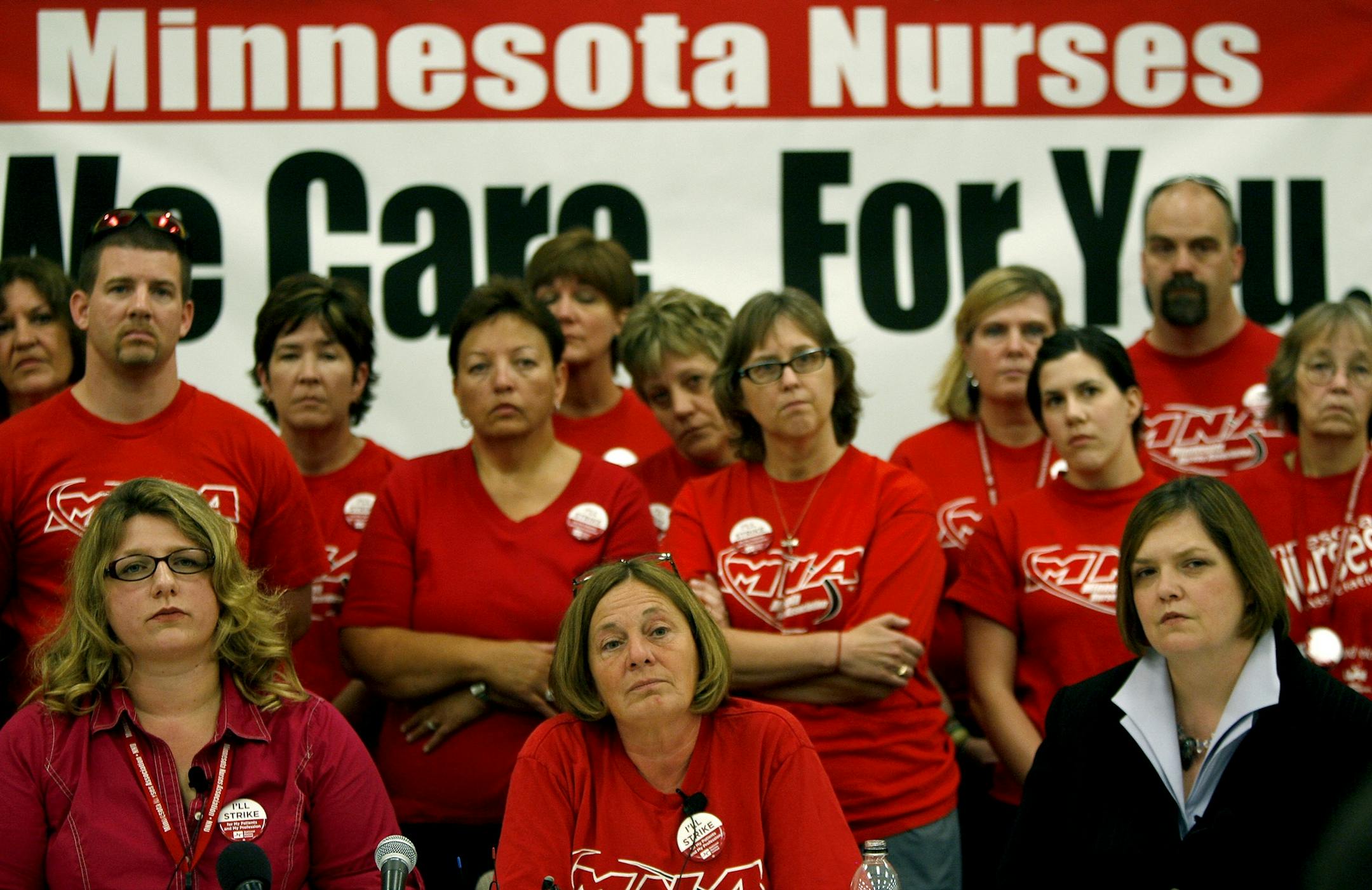Twin City nurses stood behind Erin Murphy, RN State representative, left, Cindy Olson, RN, center, and Margaret Anderson Kelliher, during a press conference where they announced that they will go on strike on June 10, 2010, from 7 am to 7 am, at the Minnesota Nurses Union Headquarters.