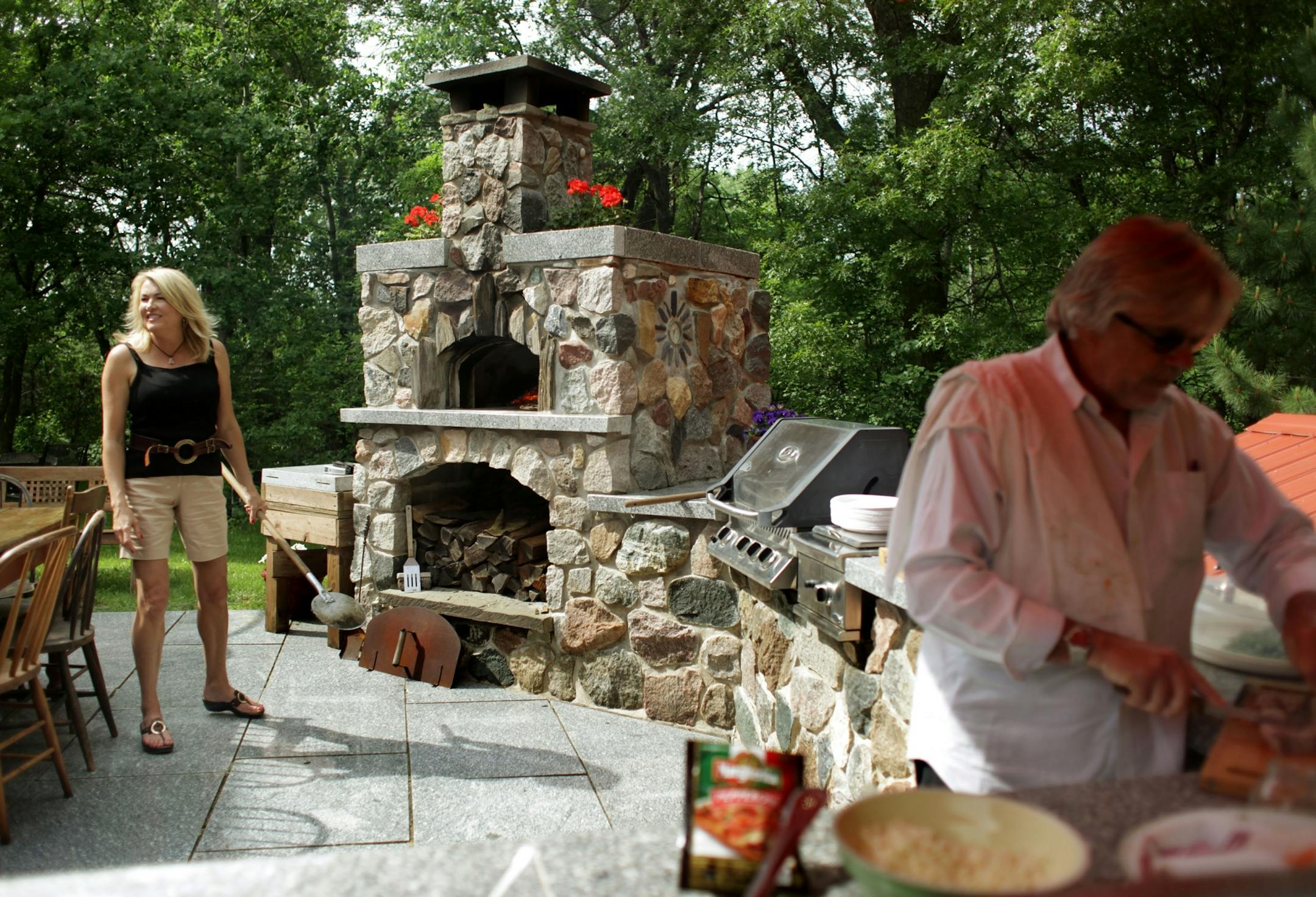 Rebecca Kolls and Roy Ahern worked in an outdoor kitchen in 2014.