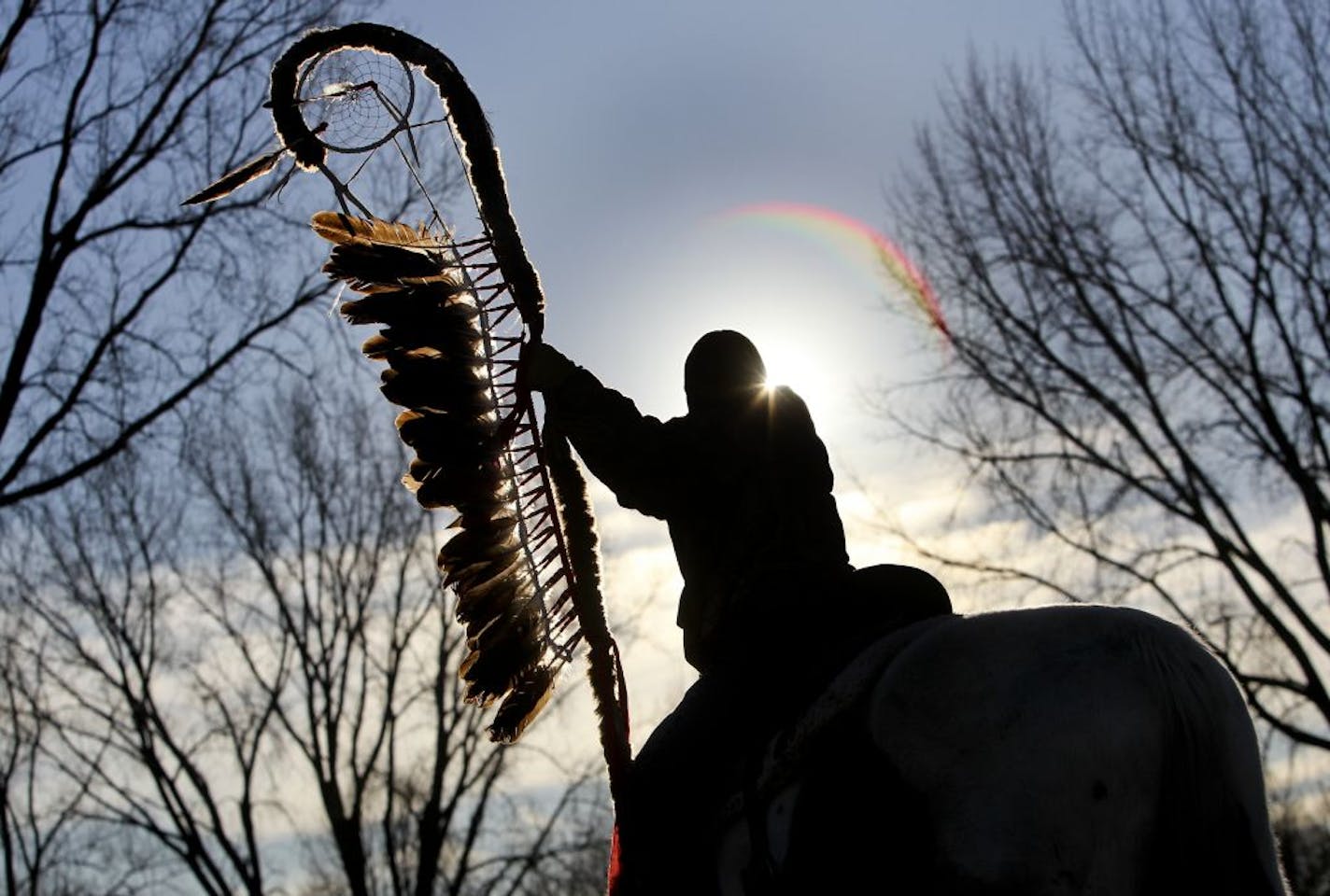 Young rider Christian Lengkeek, 10, from the Crow Creek Nation in South Dakota, held the 38 + 2 eagle staff before embarking on the final leg of the Dakota 38+2 Wokiksuye (Memorial) Horse Ride from Land of Memories Park Monday, Dec. 26, 2011 in Mankato, MN. Following the Dakota War of 1862, 38 Dakota were hanged in Mankato, MN on Dec. 26, 1862. It is the largest single mass execution in United States History. The Dakota 38+2 Wokiksuye (Memorial) Horse Ride, a 330 mile ride, commemorates the hang