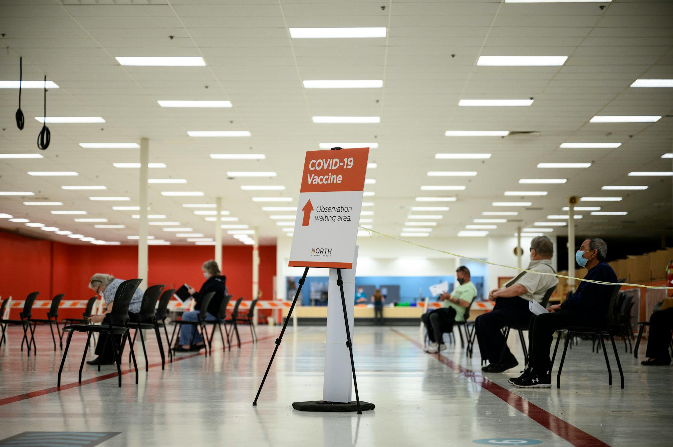 Patients who just received a dose of the Moderna COVID-19 vaccine waited in an observation area Tuesday afternoon at North Memorial Health Hospital vaccination clinic in Brooklyn Center.