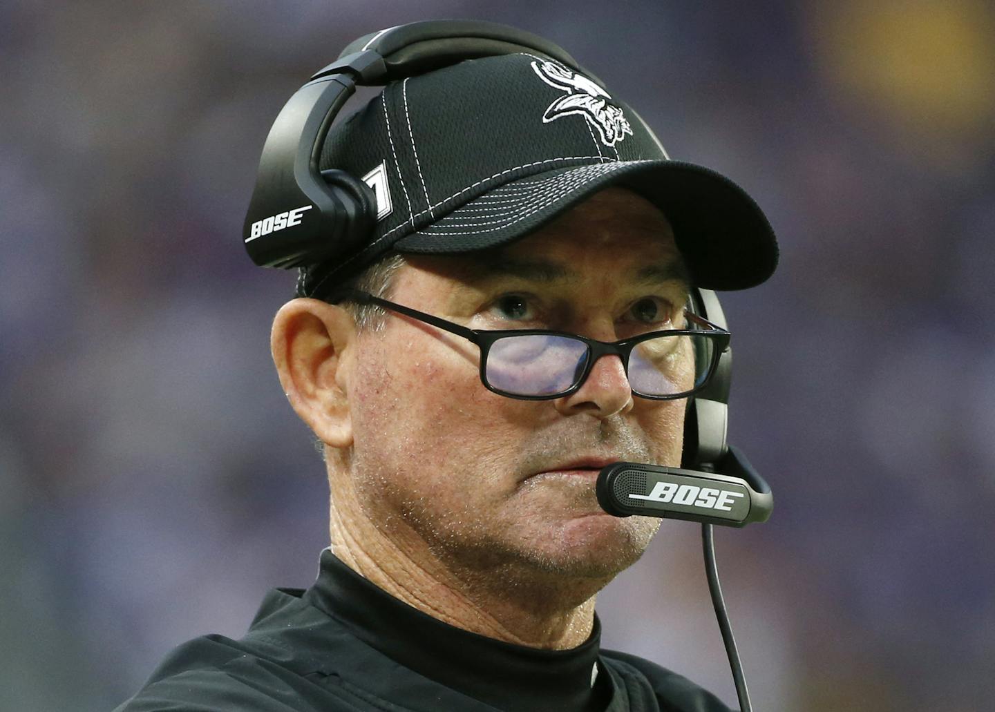 FILE - In this Dec. 8, 2019, file photo, Minnesota Vikings head coach Mike Zimmer watches from the sideline during the first half of an NFL football game against the Detroit Lions in Minneapolis. The Vikings signed head coach Zimmer on Friday, July 24, 2020, to a three-year contract extension through the 2023 season. Zimmer's record with the Vikings over six years is 57-38-1, plus 2-3 in the postseason. (AP Photo/Bruce Kluckhohn, File) ORG XMIT: MER9e8635cbb47778b17144c5a7fbc32