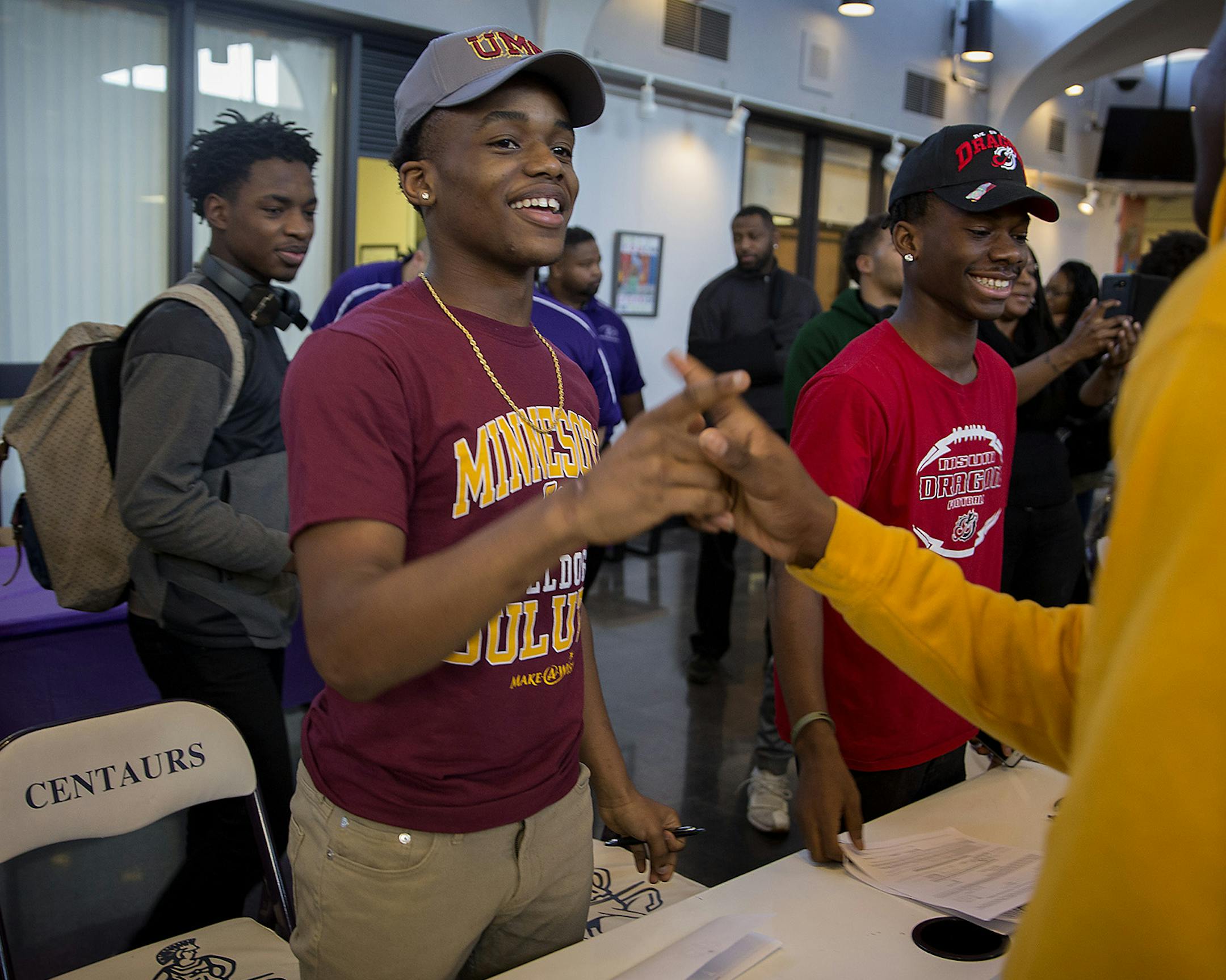 Brooklyn Center High School football player Dayvia Gbor, cq, was greeted by classmates after he signed a college football commitment with the University of Minnesota at Duluth during a signing ceremony, Wednesday, February 7, 2018 in Brooklyn Center, MN. ] ELIZABETH FLORES ï liz.flores@startribune.com