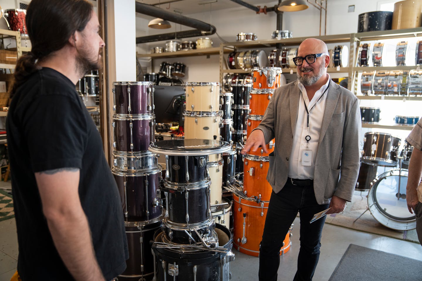 Ben Johnson, right, Minneapolis' first director of the new department of Arts &amp; Cultural Affairs, talks with Clash Drums owner Jeremy Krueth in the Flux Arts Building in northeast Minneapolis, Minn. on Friday, Sept. 8, 2023. ] LEILA NAVIDI • leila.navidi@startribune.com