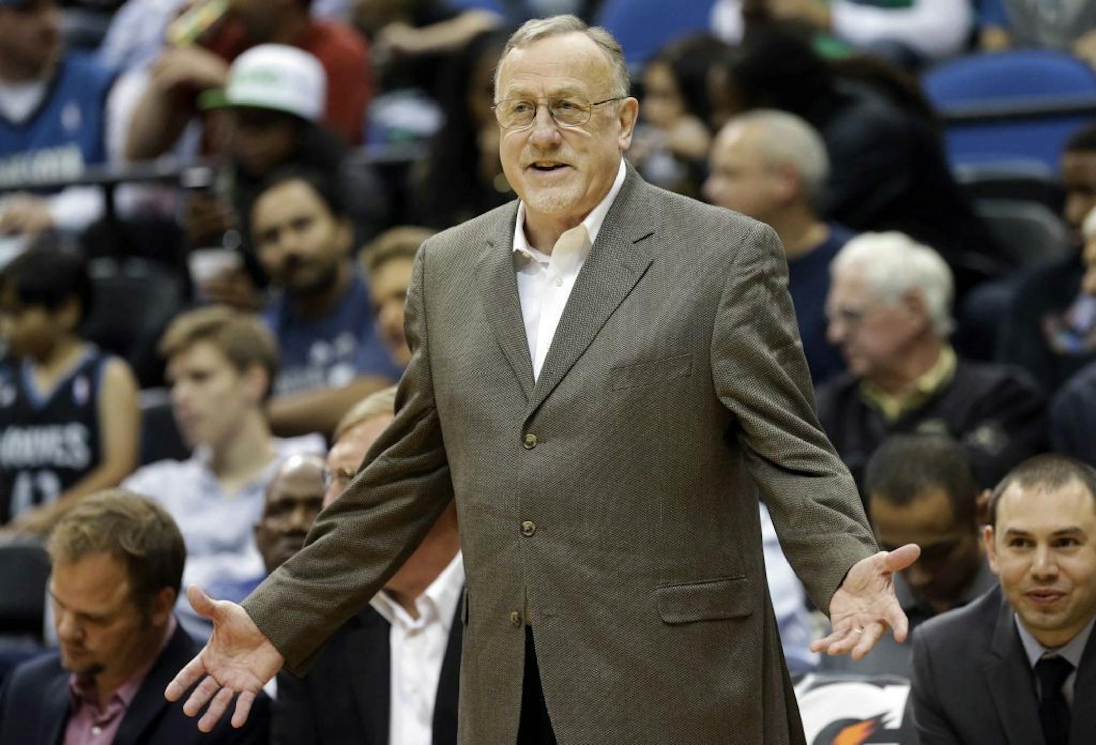 Minnesota Timberwolves head coach Rick Adelman disagrees with a call in the second half of an NBA preseason basketball game against the Toronto Raptors, Saturday, Oct. 12, 2013, in Minneapolis. The Raptors won 104-97.