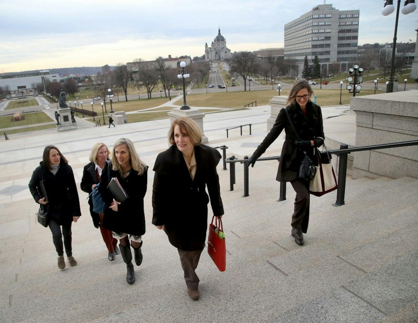 Members of the group Elder Voice Family Advocates visited the State Capitol to meet with Gov. Dayton's administration and push a package of reforms to better protect seniors from abuse. They urged lawmakers to act more aggressively to address soaring numbers of crimes in senior care facilities. Here, Elder Voice Family Advocates members Suzanne Scheller, right to left, Jean Peters, Kay Bromelkamp, Kristine Sundberg and Anne Sterner head inside the Capitol for their meeting Friday, Dec. 1, 2017,