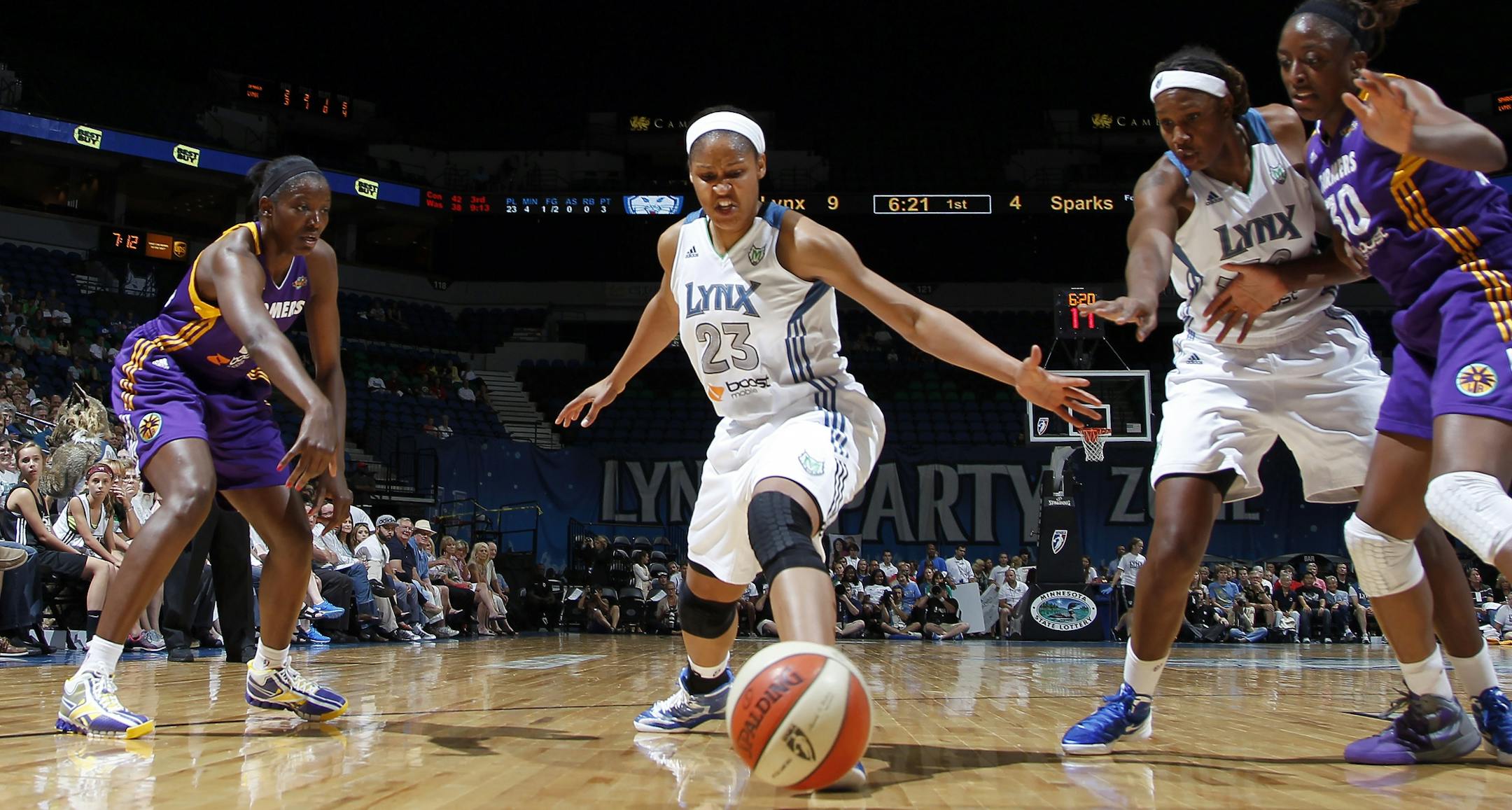 Maya Moore (23) stretched out to attempt to block a pass by DeLisha Milton-Jones in the first quarter.