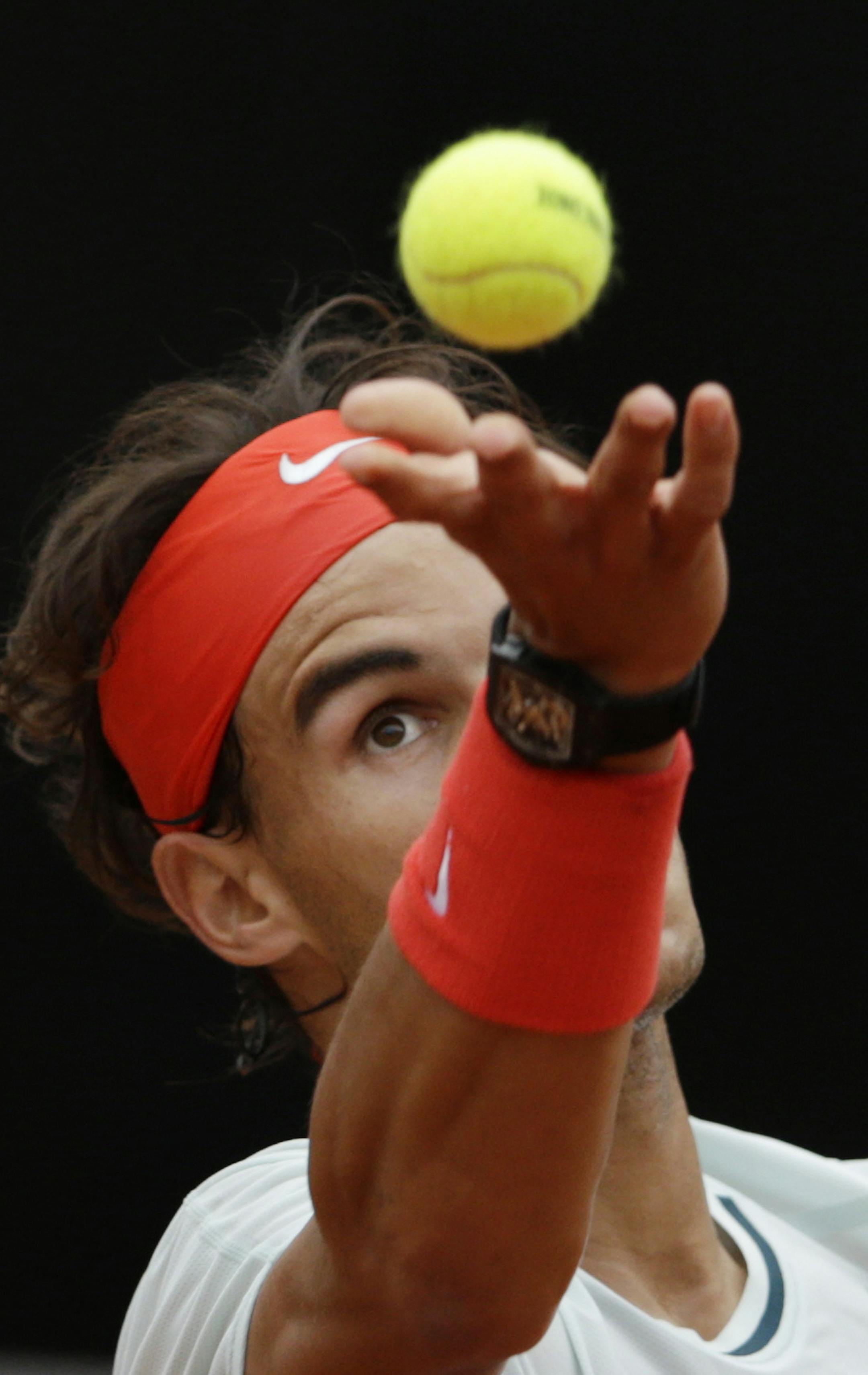 Spain's Rafael Nadal serves the ball to Latvia's Ernests Gulbis during their match at the Italian Open tennis tournament in Rome, Thursday, May 16, 2013. (AP Photo/Andrew Medichini) ORG XMIT: MIN2013052421243521