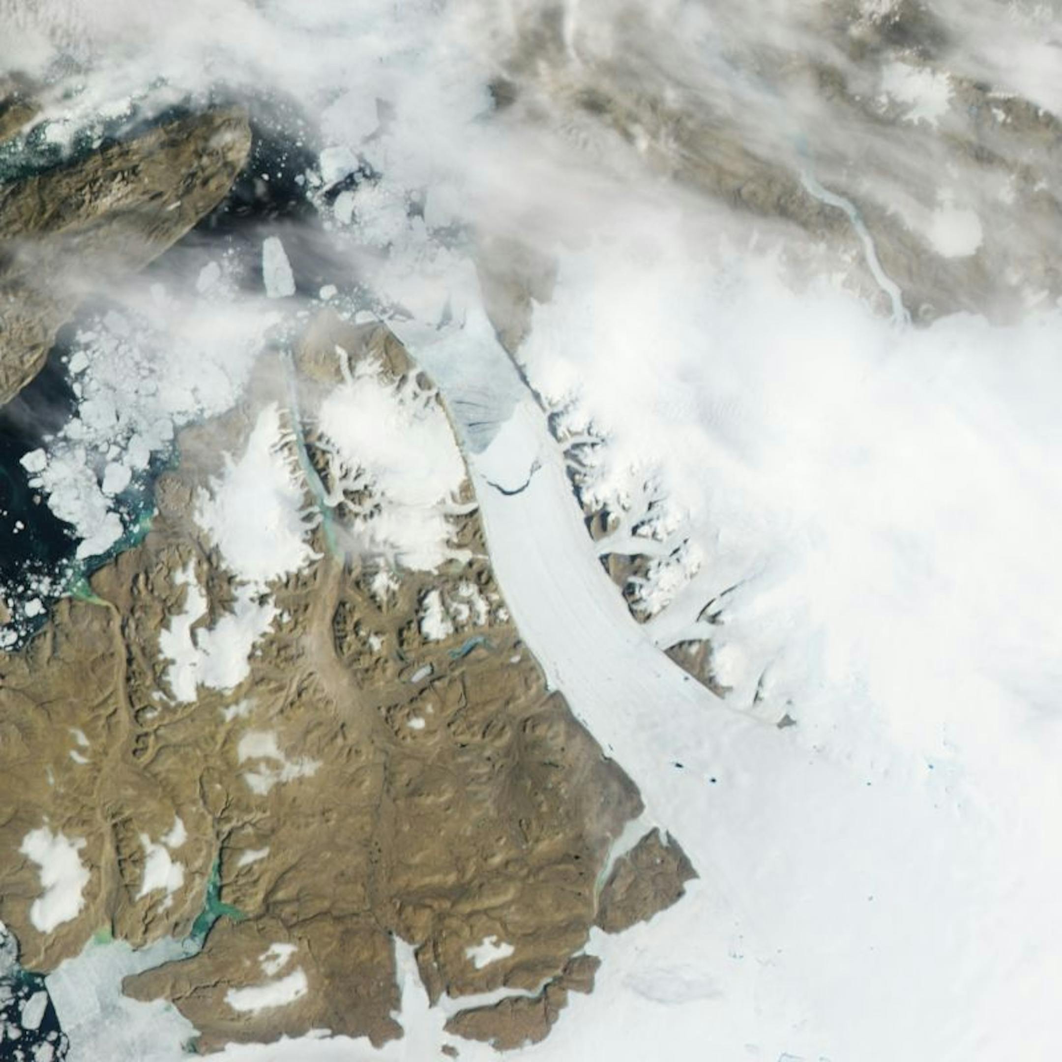 This Monday, July 16, 2012 satellite image provided by NASA shows calving, crescent-shaped crack at center, on the Petermann Glacier in northwestern Greenland. An iceberg twice the size of Manhattan tore off one of Greenland's largest glaciers. Scientists had been watching the 15-mile long crack in the floating ice shelf of the northerly Petermann Glacier for several years. On Monday NASA satellites showed it had broken completely, forming a 46 square mile iceberg. Petermann spawned an iceberg t