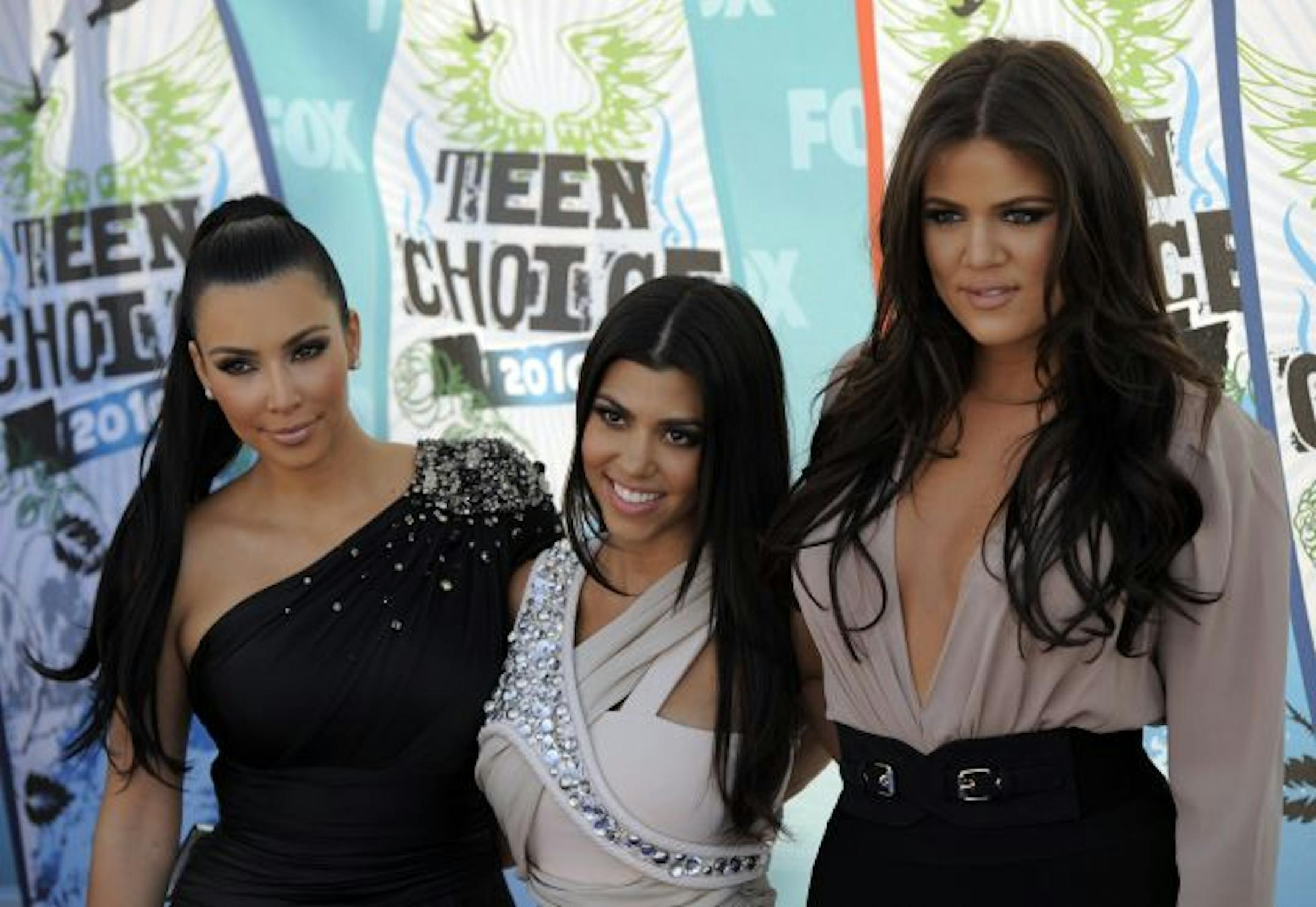 Sunrise Community Banks in St. Paul agreed to issue a reloadable debit card with the likenesses of, from left, reality TV celebrities Kim, Kourtney and Khloe Kardashian. But, when only 250 people signed up for the cards, the two sides parted company.