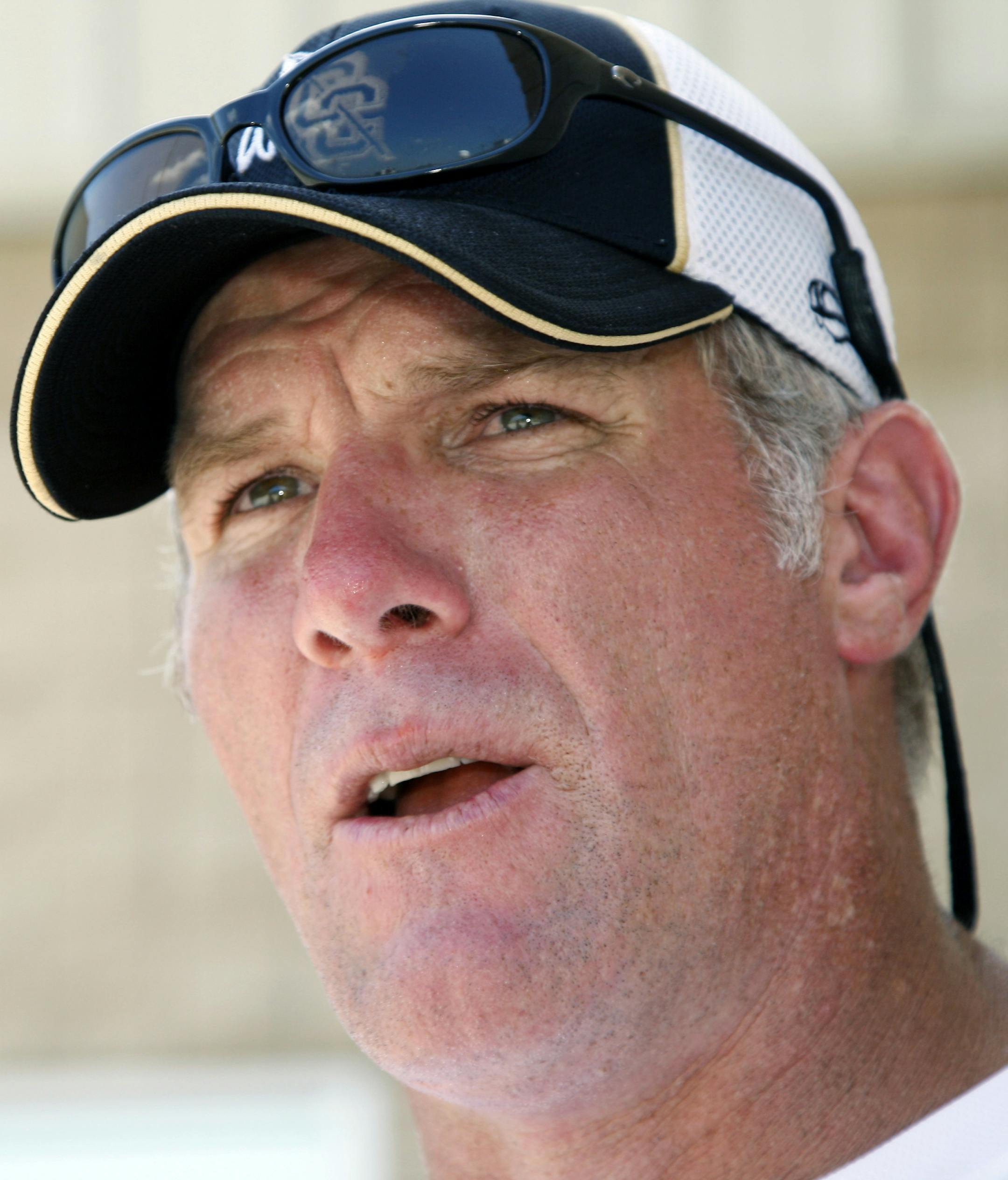 FILE - In this July 30, 2012, file photo, former NFL quarterback Brett Favre speaks to the media in Hattiesburg, Miss. Favre says he couldn't be happier to see Peyton Manning on the brink of breaking his NFL record of 508 touchdown throws. Manning has 503 heading into Denver's road game Sunday, Oct. 12, 2014, against the New York Jets. (AP Photo/Rogelio V. Solis, File)