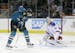 San Jose Sharks' Tomas Hertl, left, of the Czech Republic, scores his fourth goal of the game past New York Rangers goalie Martin Biron (43) during th