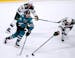 San Jose Sharks right wing Timo Meier (28) battles for the puck against Minnesota Wild defenseman Carson Soucy (21) during the third period of an NHL 