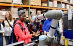 Kayla Pollard, a student at Minneapolis Roosevelt High School learned about robotics during a tour of Graco's Minneapolis facilities. submitted photo