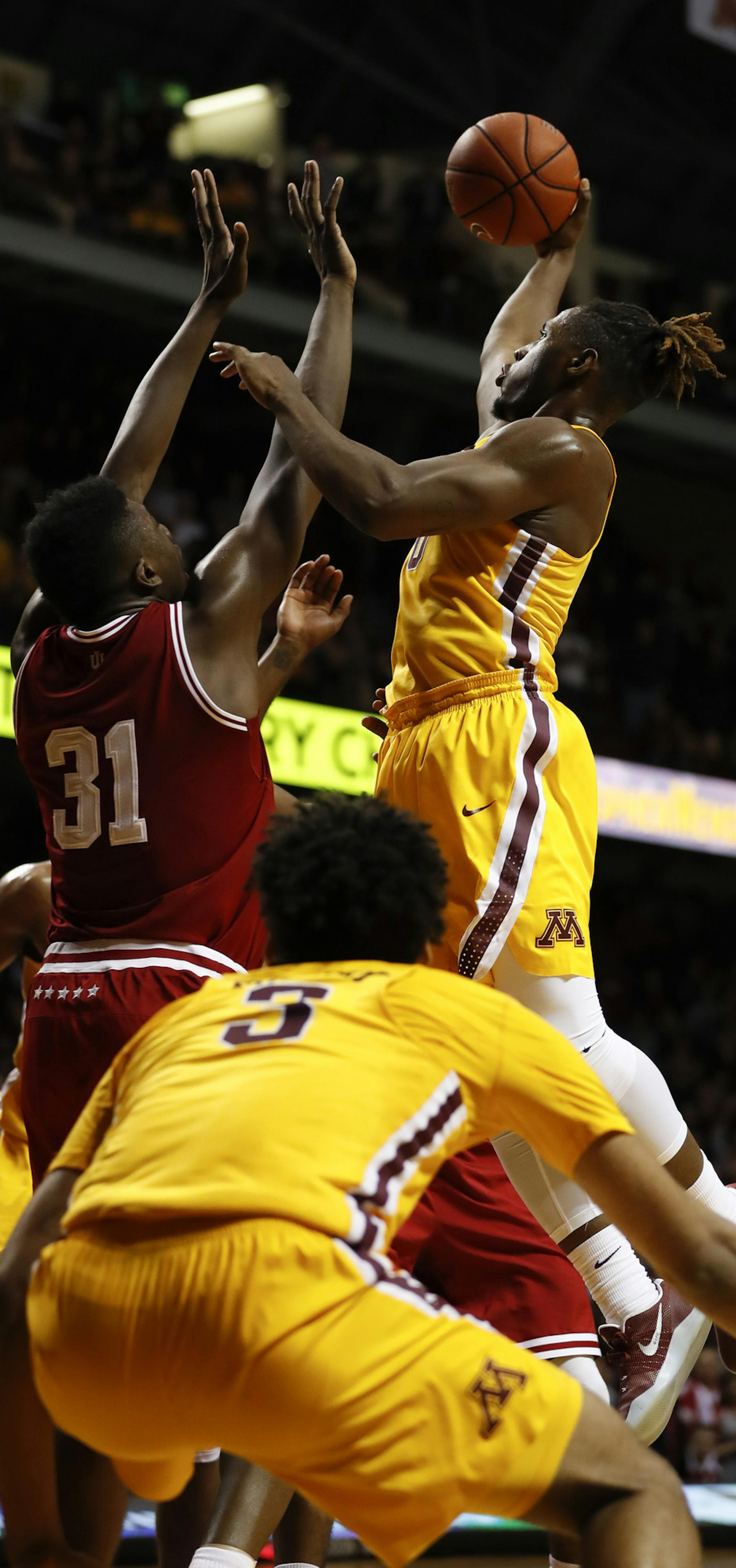 Gophers guard Akeem Springs (0) made the winning shot over Indiana Hoosiers center Thomas Bryant (31) with just second left on the clock to put Minnesota ahead. ] JEFF WHEELER ï jeff.wheeler@startribune.com The University of Minnesota men's basketball team eked out a 75-74 win over Indiana University in a Big 10 Conference basketball game Wednesday night, February 15, 2017 at Williams Arena in Minneapolis.