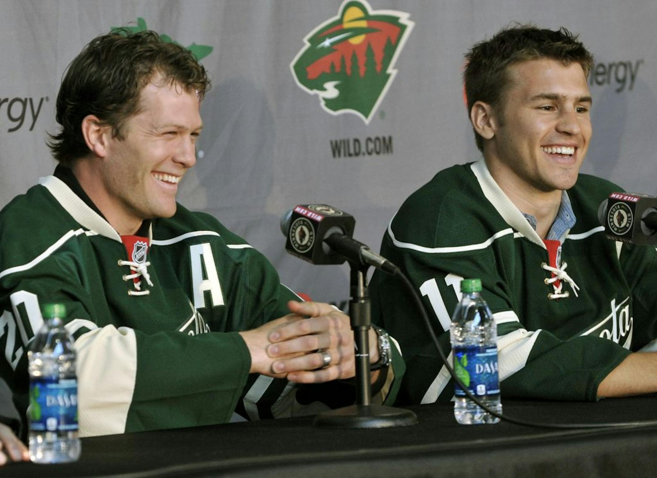 New Minnesota Wild NHL hockey players Ryan Suter, left, and Zach Parise are introduced during a news conference Monday, July 9, 2012 in St. Paul, Minn. The two signed 13-year contracts with the Wild for $98 million.