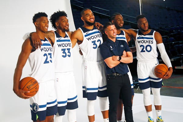 Timberwolves head coach Ryan Saunders poses with players, from left: Jarrett Culver, Robert Covington, Karl-Anthony Towns, Andrew Wiggins and Josh Oko
