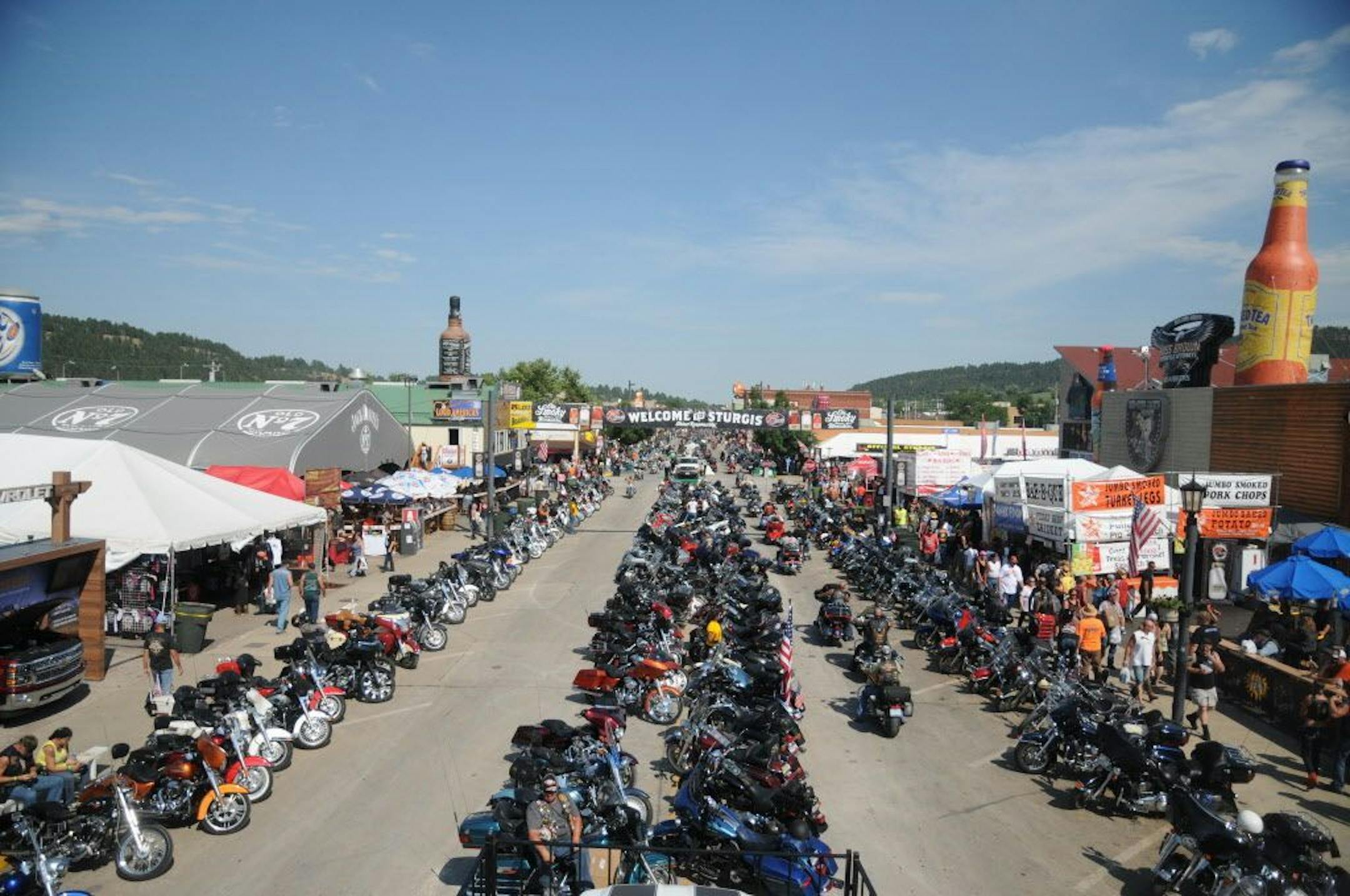 Motorcycles stretch down Main Street in Sturgis, S.D., on Wednesday, Aug. 5, 2015, for the landmark 75th Sturgis Motorcycle Rally.
