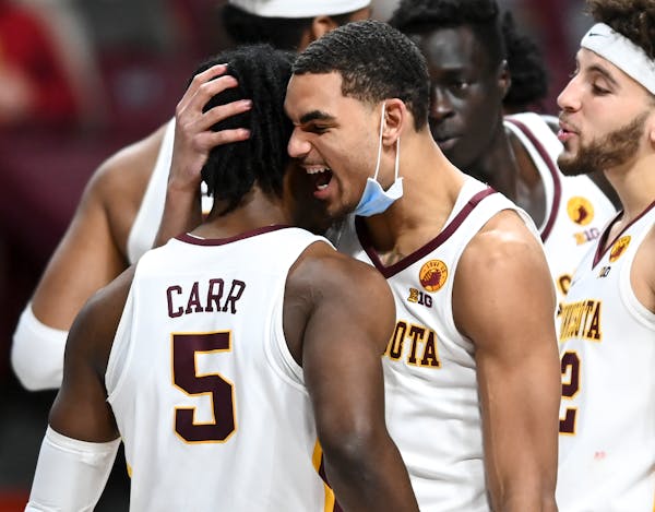 Gophers guard Tre’ Williams and guard Marcus Carr celebrated against Purdue.
