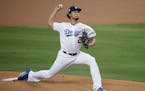 Los Angeles Dodgers starting pitcher Yu Darvish, of Japan, throws against the Houston Astros during the first inning of Game 7 of baseball's World Ser