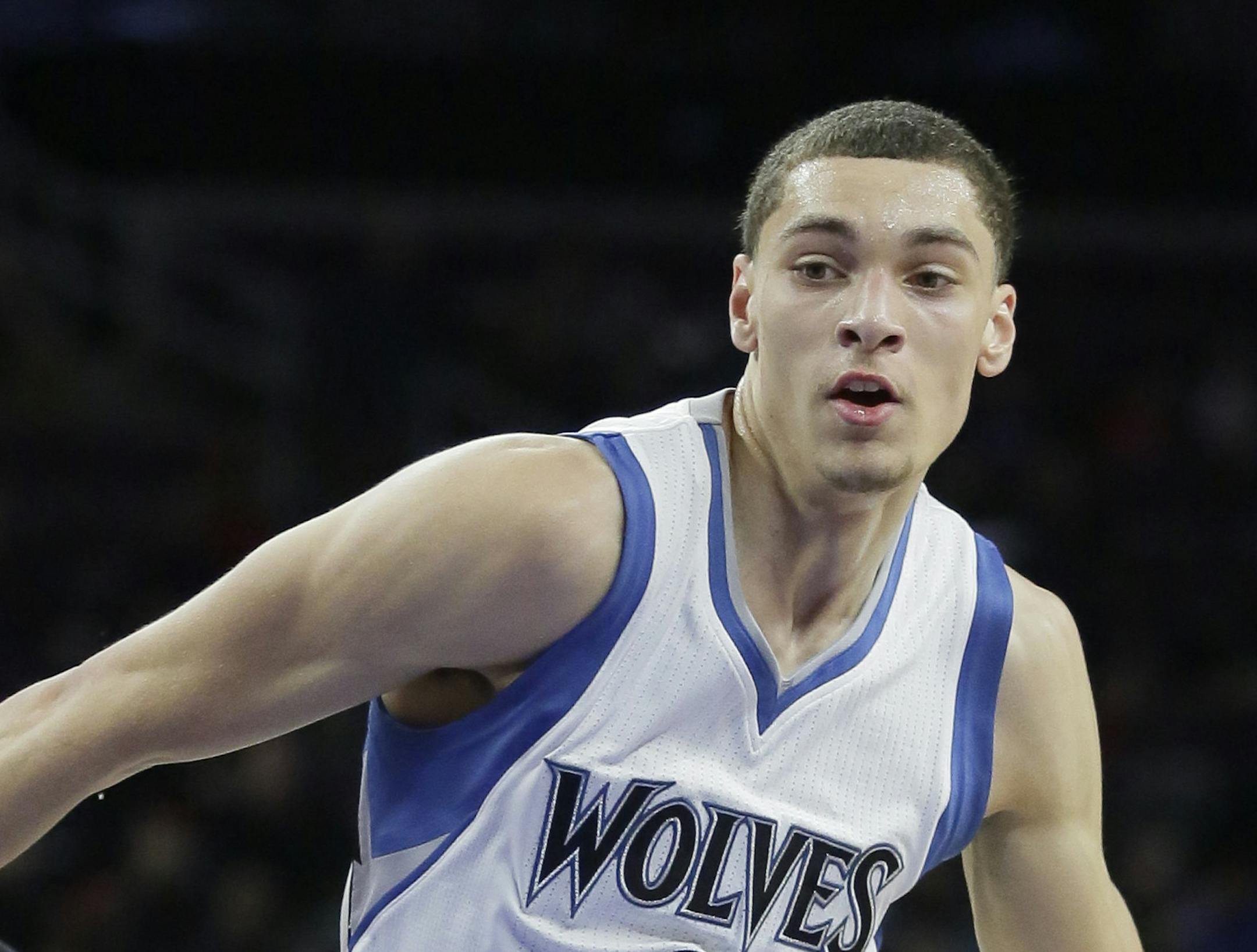 Minnesota Timberwolves' Zach LaVine (8) drives to the basket past Detroit Pistons' John Lucas III (9) during the first half of an NBA basketball game Sunday, Feb. 8, 2015, in Auburn Hills, Mich. (AP Photo/Duane Burleson)