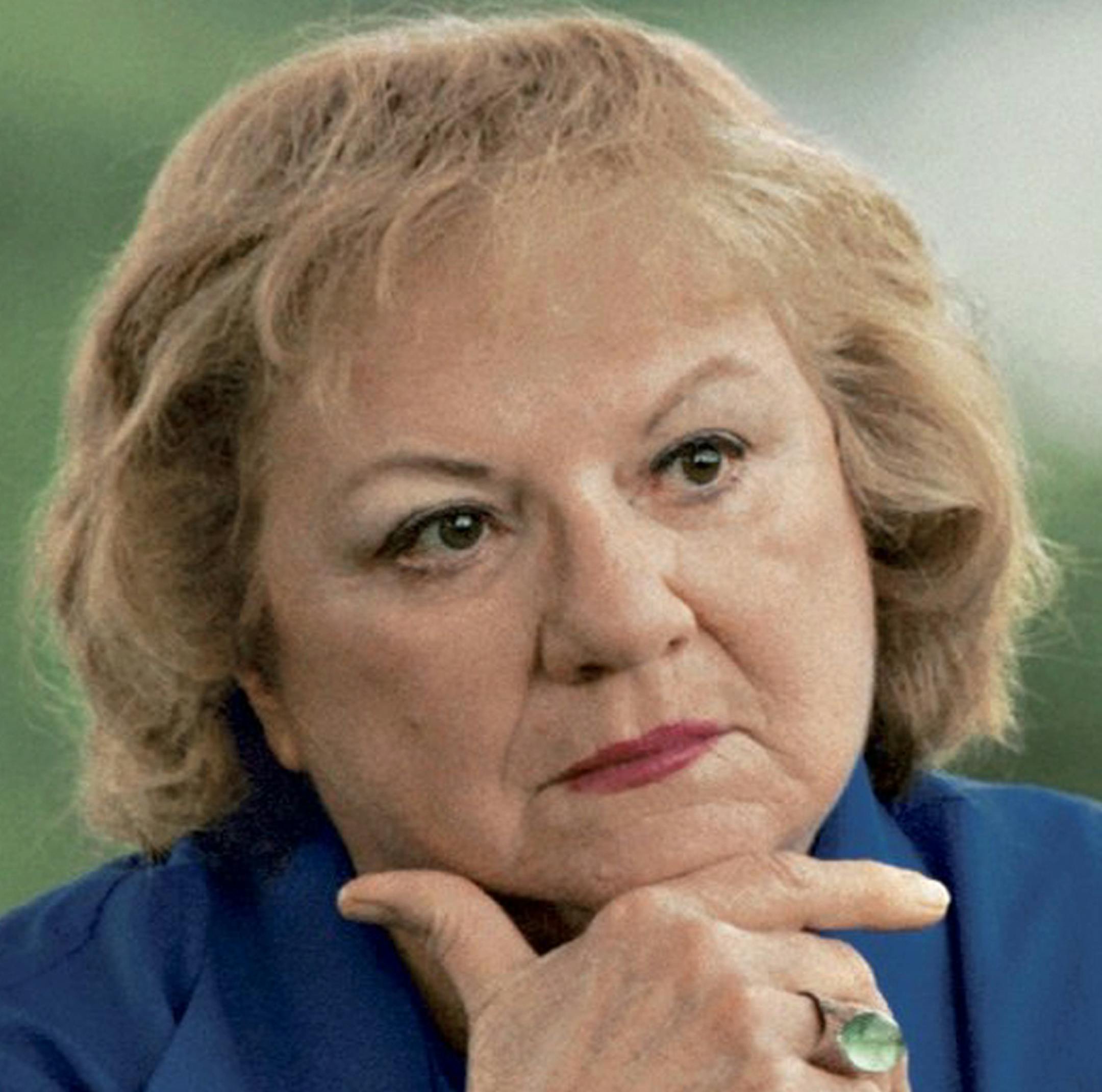 FILE - This July 2004 file photo shows, true-crime author Ann Rule, who wrote a book about serial killer Gary Ridgway, who left some of his victims' bodies along the Green River outside Seattle, Wash., shown in the background. Rule, who wrote more than 30 books, including a profile of her former co-worker, serial killer Ted Bundy, has died at age 83. Scott Thompson, a spokesman for CHI Franciscan Health, said Rule died at Highline Medical Center at 10:30 p.m. Sunday, July 26, 2015. (Betty Udeson