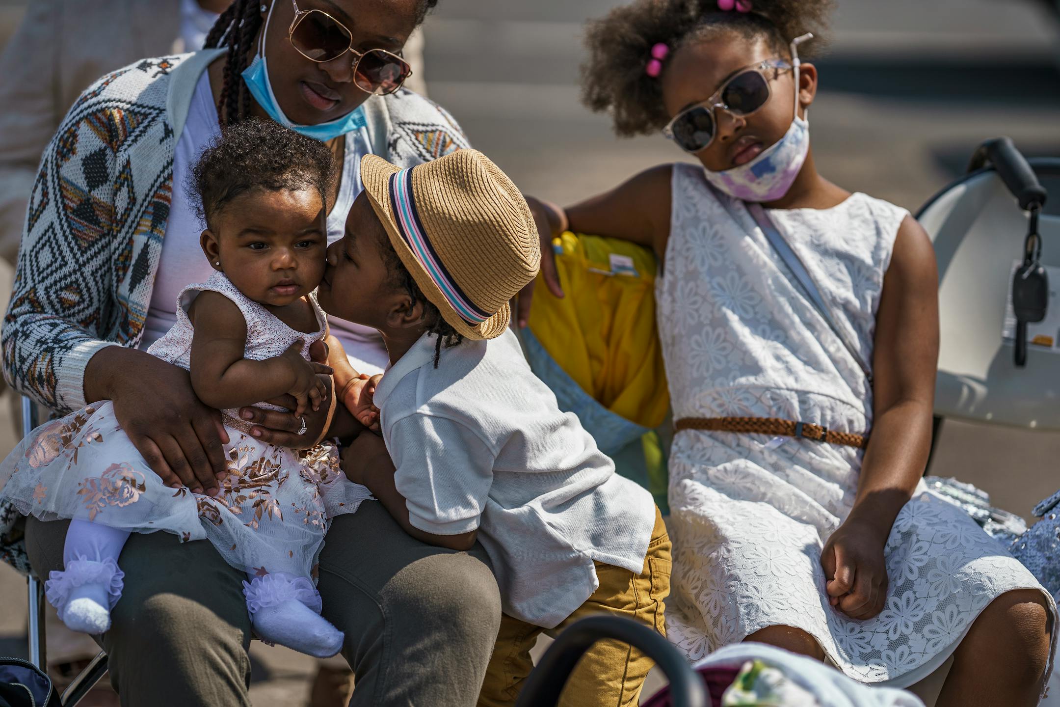 On April 4, 2021, at George Floyd Square, Aryssa Newman, her children Kenzlei, 6 months, Prince, 5, Arielle, 6, and Ellianna, 8, sat together during the Easter service with a sermon largely focused on George Floyd and social justice.