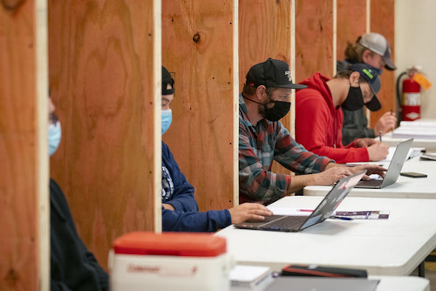 Students in Commercial and Residential Wiring class have their own wooden cubicles to help promote better social distancing during a full class. ] ALEX KORMANN • alex.kormann@startribune.com Lake Superior College has begun hybrid in person classes with an emphasis on social distancing. Classes have been designed so no more than 25-30% of the student body is on campus on any one day. Students and faculty are required to wear face coverings as well.