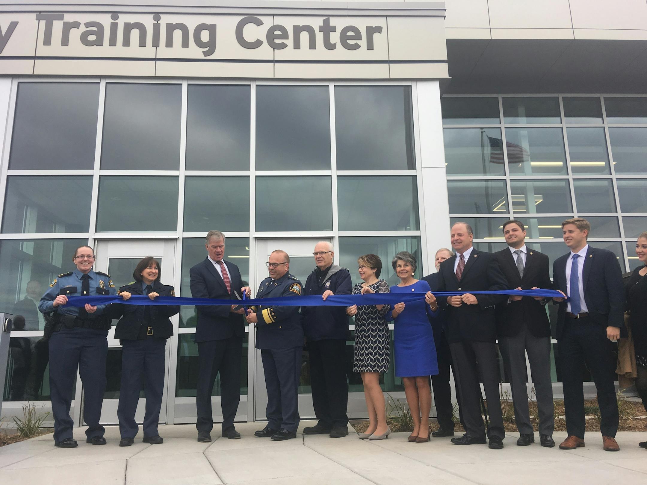 Mayor Chris Coleman, Police Chief Todd Axtell and others celebrate the opening of the Richard H. Rowan Public Safety Training Center at 600 Lafayette Road.