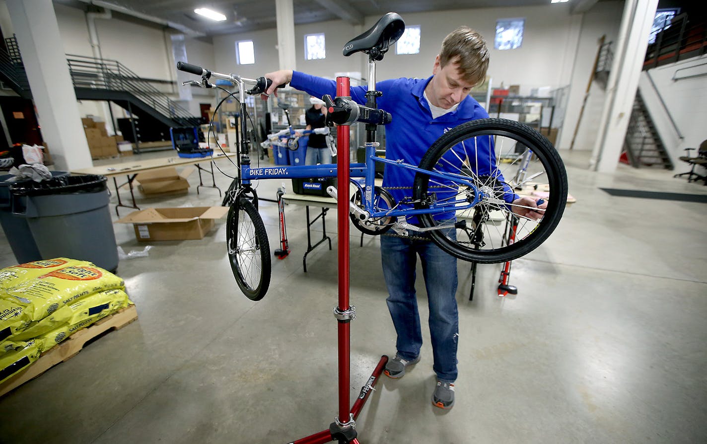 Danny McCullough, of the Three Rivers Park District, worked on assembling one of 37 bikes, Thursday, January 7, 2015 at their Administrative Center in Plymouth, MN. The Three Rivers Park District received a MNDOT Safe Routes to School grant to purchase the fleet of bikes for youth education programs. They are adjustable bikes to fit a 6-year-old to high schooler. ] (ELIZABETH FLORES/STAR TRIBUNE) ELIZABETH FLORES &#x2022; eflores@startribune.com