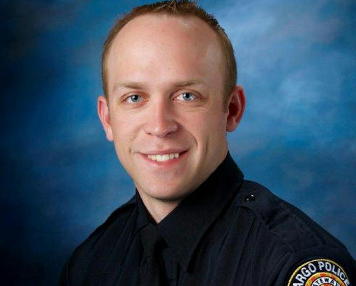 Fargo police officer Jason Moszer, 33, was shot during a standoff in Fargo, N.D. with a domestic violence suspect.