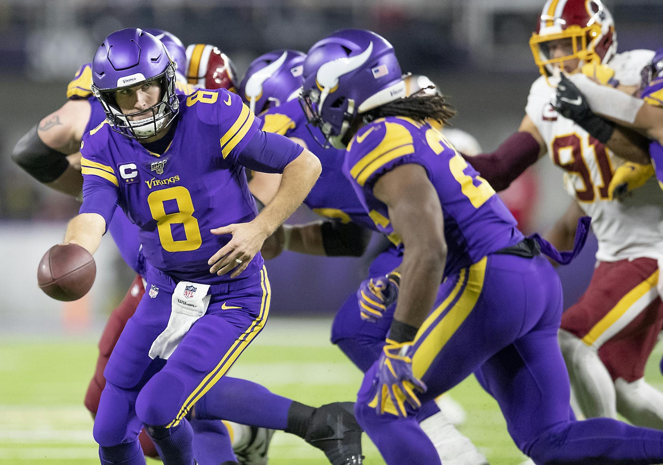 Vikings quarterback Kirk Cousins handed the ball to Vikings running back Alexander Mattison during the third quarter.