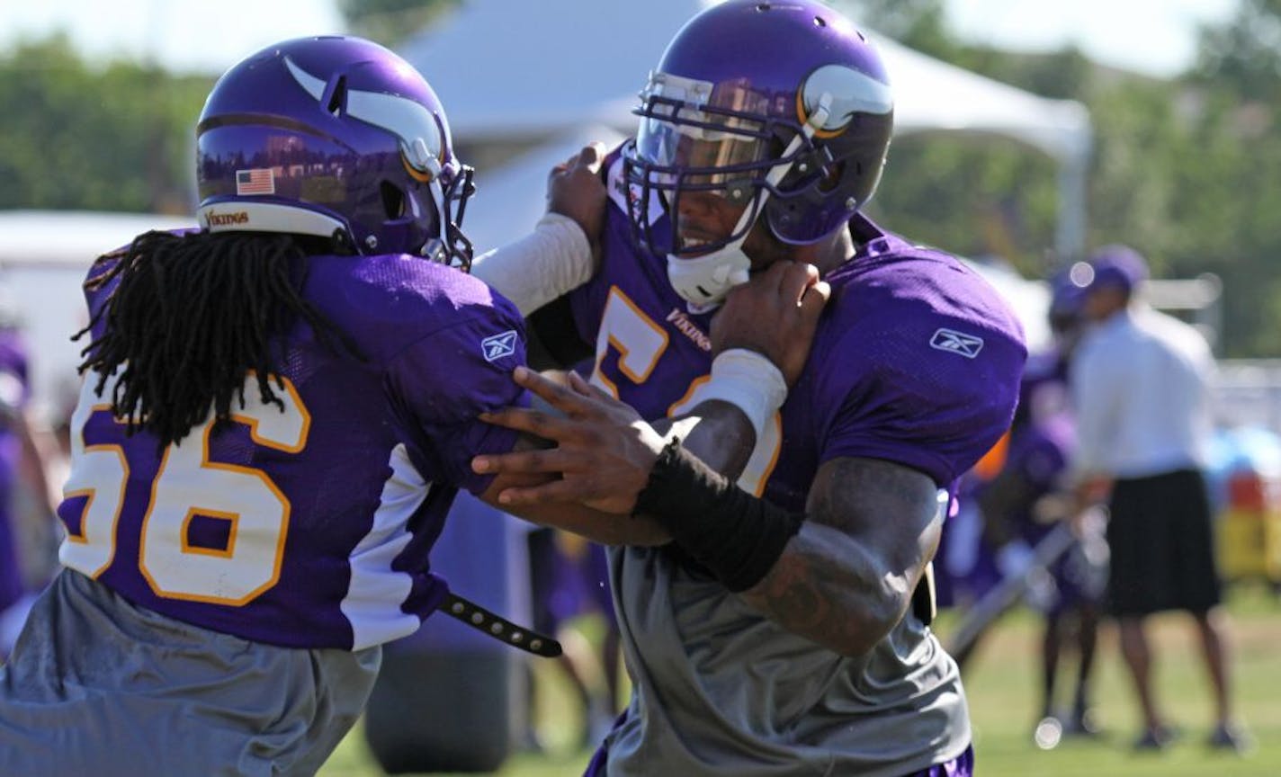 Vikings linebackers E.J. Henderson, left, and Erin Henderson worked on drills during training camp on Wednesday. Both Hendersons could end up starting for the team.